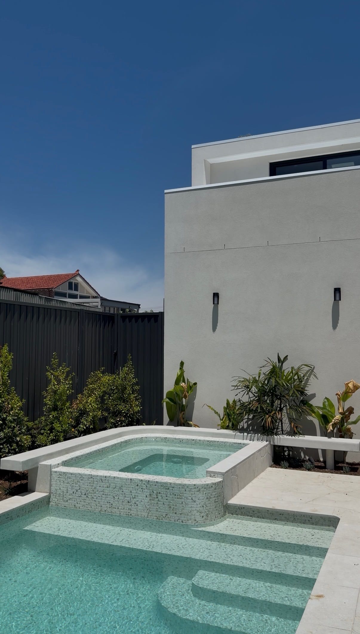 Luxury pool with floating architectural concrete seat