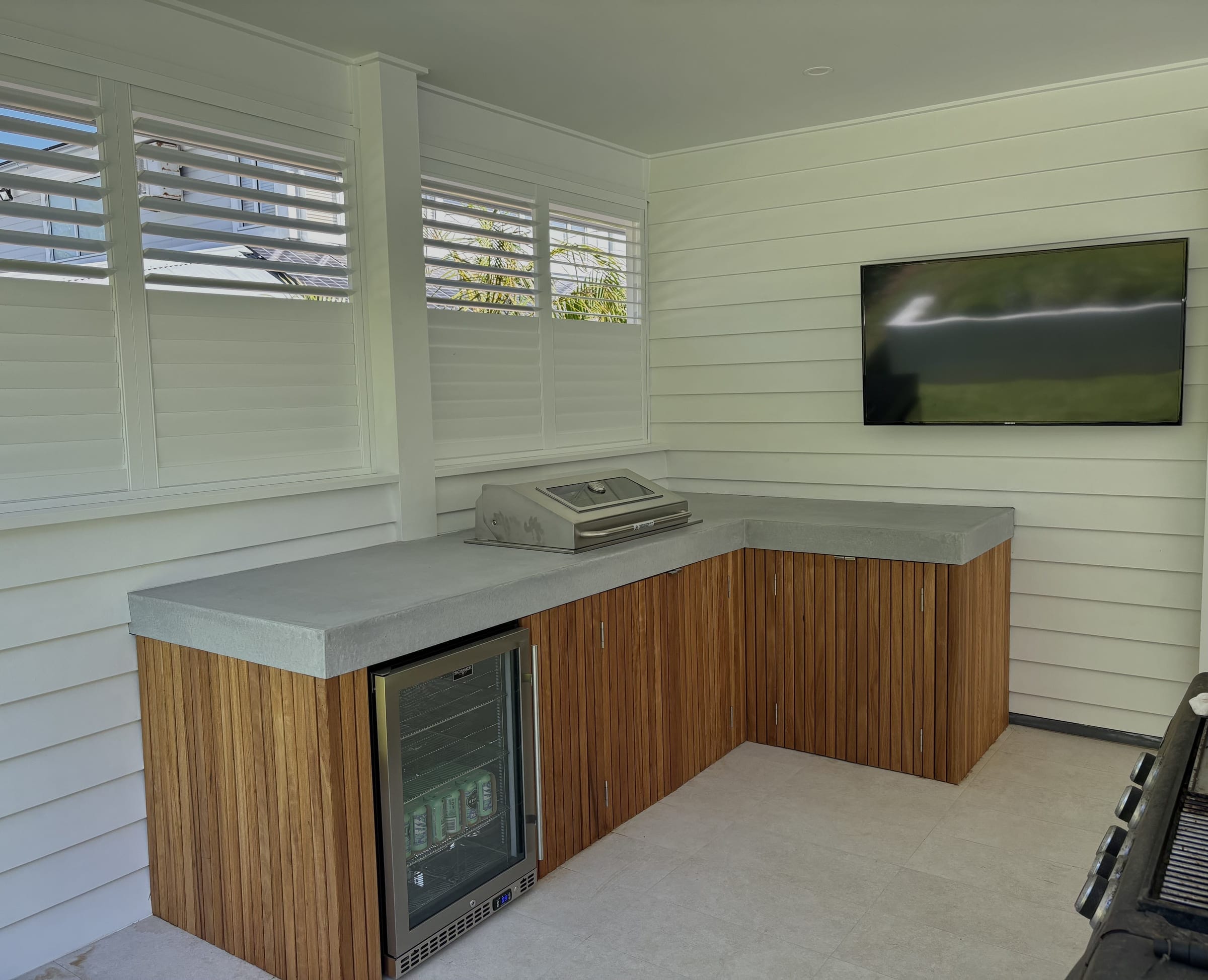 Avalon residence — completed architectural concrete benchtop with integrated BBQ