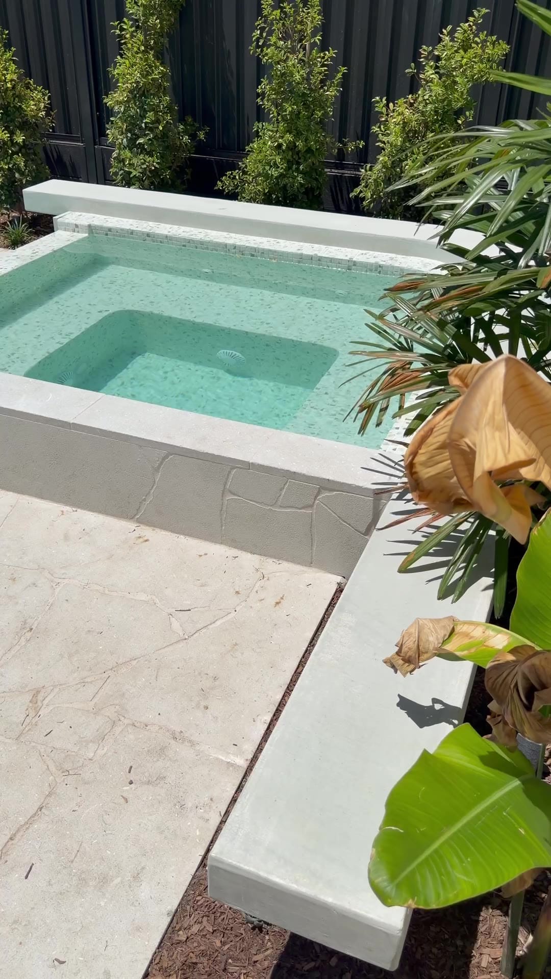 Zetland courtyard — sculptural architectural concrete seats framing the spa